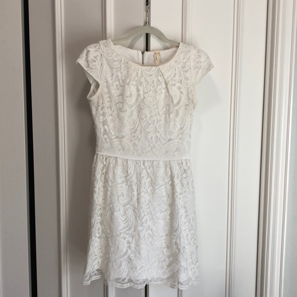 White eyelet style short dress with cap sleeves